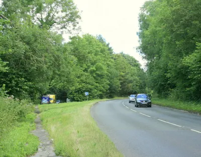 A4 heading east through Derry Woods The route of the road before improvements makes a convenient layby on the left.