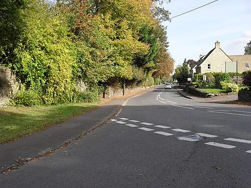 A361 in Shipton Under Wychwood. At the northern end of the village. Photo taken looking east from the junction with the road to Milton Under Wychwood.
