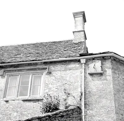 Vertical sundial on Sundial Cottage, Ampney St Peter, Gloucestershire