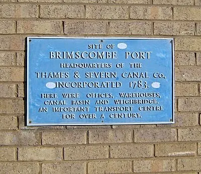 Blue Plaque at Brimscombe Port. This blue plaque on a factory building at the entrance to the site of 1054662 commemorates its historical significance.