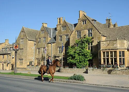 A rider passes in front of the Lygon Arms hotel in Broadway, a Cotswolds village. The first recorded date in the history of The Lygon Arms (then the White Hart Inn) is in 1532, when the Broadway Parish Register noted its owner as Mr Thomas White, a local wool merchant. 
Oliver Cromwell, who became Lord Protector of England in 1653, stayed at The Inn on 2nd September 1651, the night before the Battle of Worcester, the final and decisive battle of the great Civil War, fought between King Charles I and his "Cavaliers" and Parliament's "Roundheads".