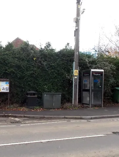 Bench and silver phonebox, Shaw