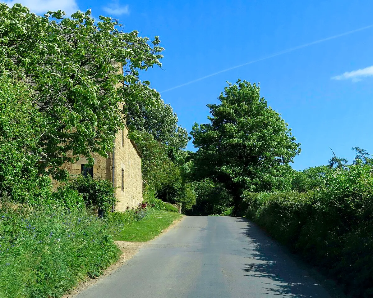 A rural road passes Hidcote Cottage