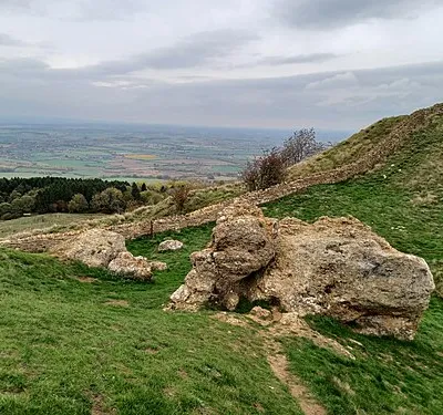 The Banbury Stone, a natural rock outcrop within Kemerton Camp Iron Age hillfort on Bredon Hill, Worcestershire, England. The Stone has folklore attached which says that it goes down to the river to drink at midnight, or alternatively when it hears the bells of Pershore Abbey.