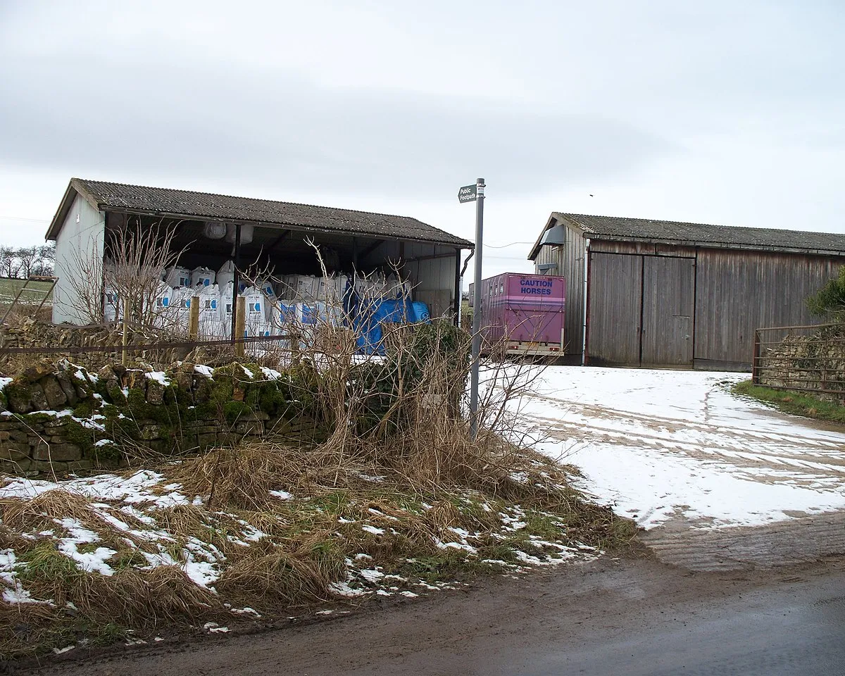 Barns at the start of the footpath The footpath leaves the minor road through Kineton and heads towards Castlett Farm. The barns are part of Home Farm.