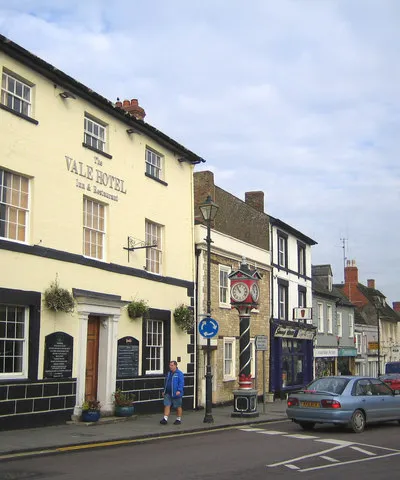 Cricklade: High Street This view was taken looking north along the High Street at its junction with the B4040 Calcutt Street. The Vale Hotel was originally the White Horse Inn, and there is a small but fine clock tower at the junction.